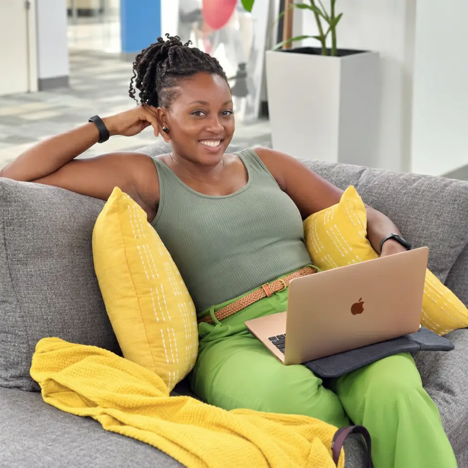 Member working on a laptop in The HUB lounge