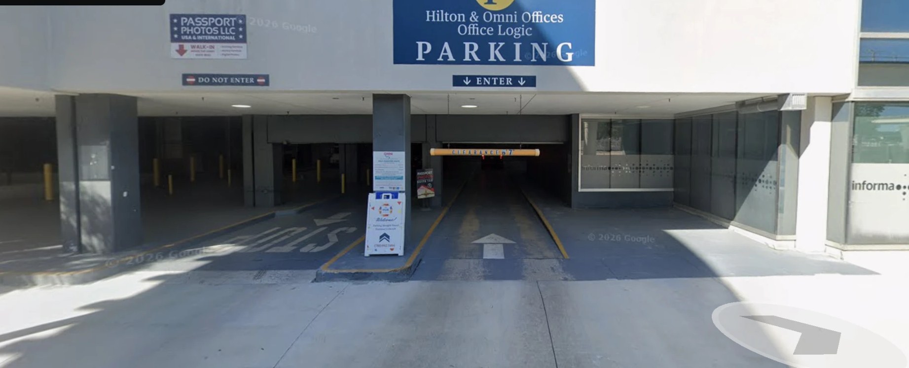 The parking garage entrance at 453 NE 15th Street, marked Hilton & Omni Offices / Office Logic Parking