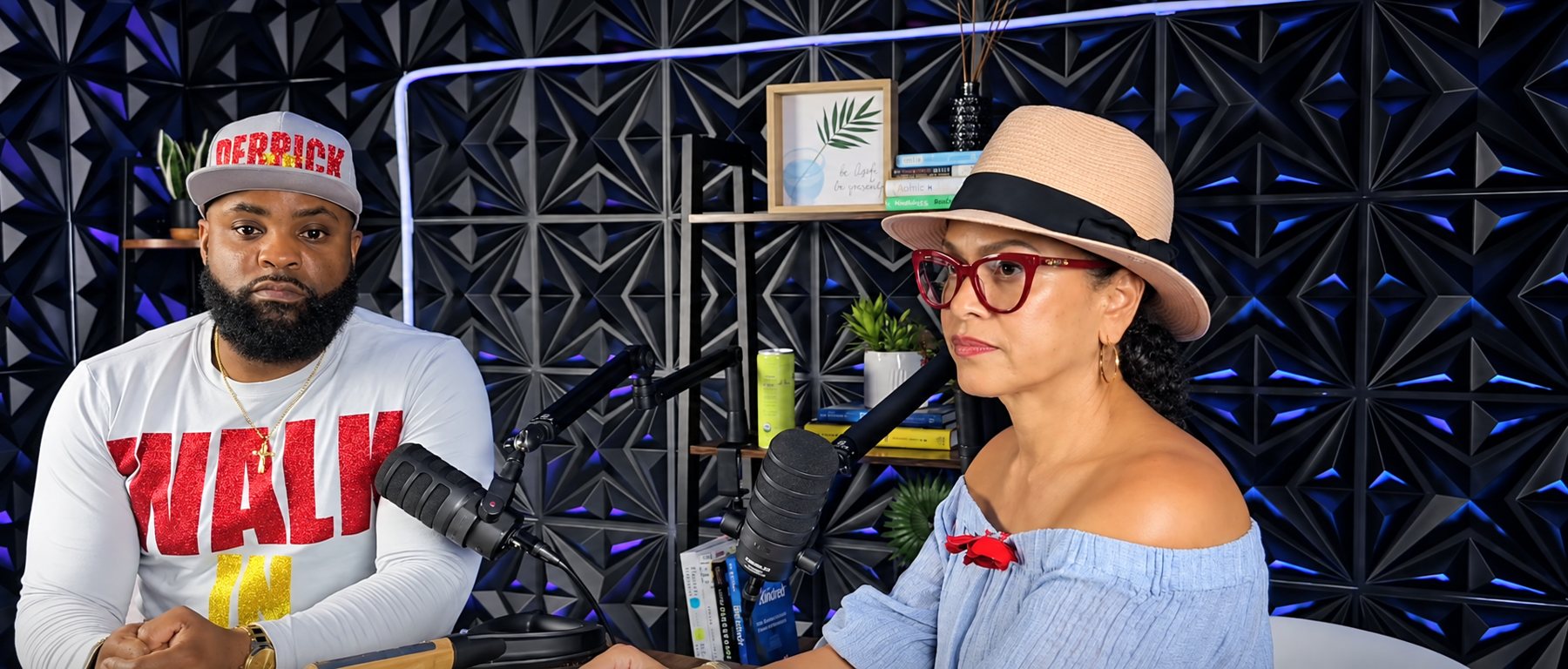 Two speakers recording at The HUB Voices podcast studio.